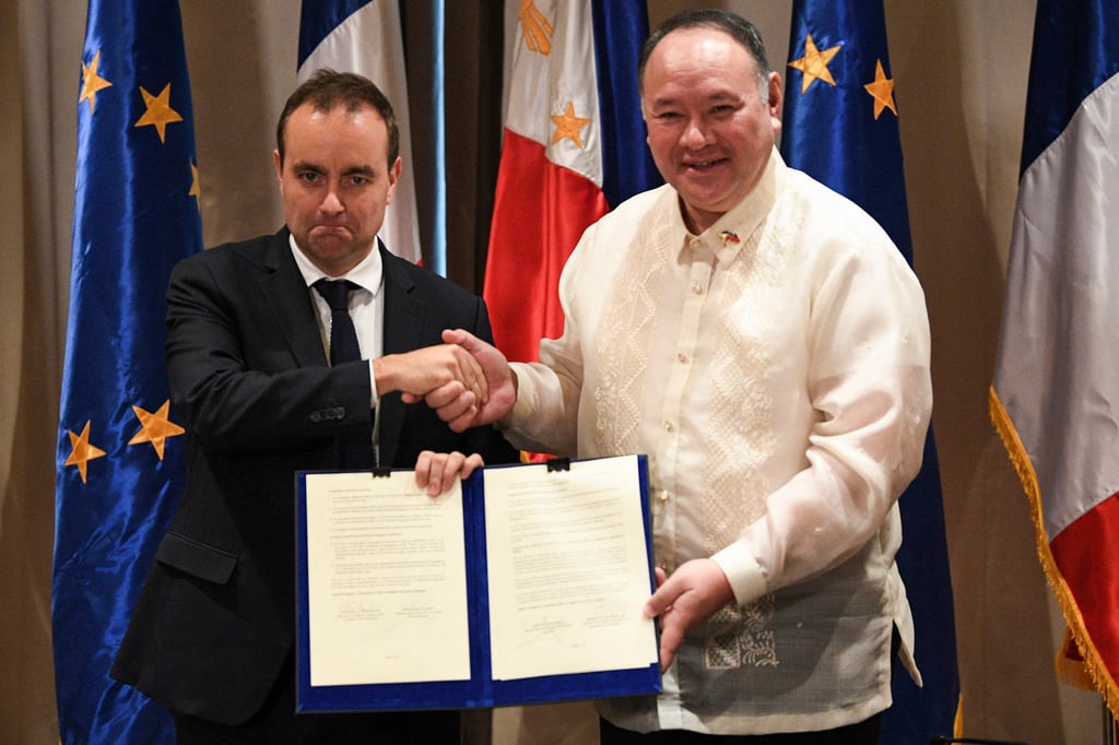 France’s Minister for the Armed Forces Sebastien Lecornu (L) shakes hands with Secretary of National Defence of Philippines Gilbert Teodoro after signing documents at a hotel in Manila on December 2, 2023. Photo: AFP France’s Minister for the Armed Forces Sebastien Lecornu (L) shakes hands with Secretary of National Defence of Philippines Gilbert Teodoro after signing documents at a hotel in Manila on December 2, 2023. Photo: AFP