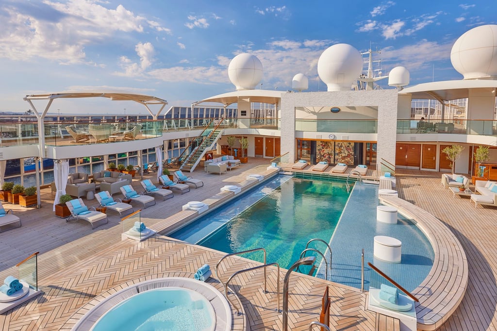 Among the facilities on board The World are two swimming pools (the main pool is pictured above), a fitness centre, a spa, a theatre, a golf simulator and a regulation-size tennis court. Photo: The World Among the facilities on board The World are two swimming pools (the main pool is pictured above), a fitness centre, a spa, a theatre, a golf simulator and a regulation-size tennis court. Photo: The World