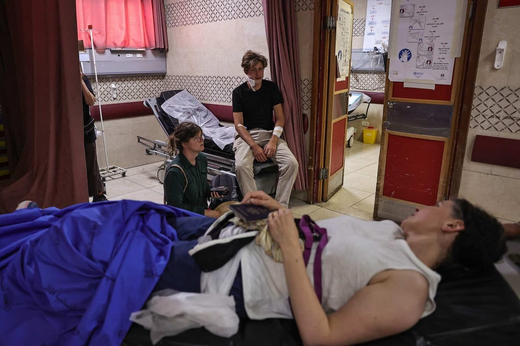 Foreign volunteers, some from the US, receive treatment at Nablus’ Rafidia Hospital on Sunday. Photo: AFP Foreign volunteers, some from the US, receive treatment at Nablus’ Rafidia Hospital on Sunday. Photo: AFP