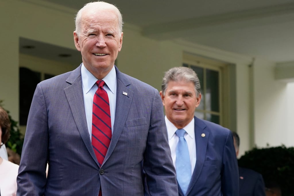 US President Joe Biden, left, with Senator Joe Manchin. On Sunday, Manchin urged Biden to drop his re-election bid. Photo: AP US President Joe Biden, left, with Senator Joe Manchin. On Sunday, Manchin urged Biden to drop his re-election bid. Photo: AP
