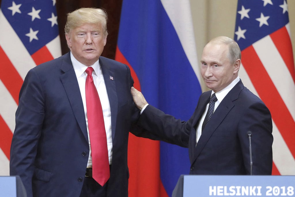 Former US president Donald Trump, left, and Russian President Vladimir Putin in Helsinki, Finland in 2018. Photo: Tass / Abaca Press / TNS