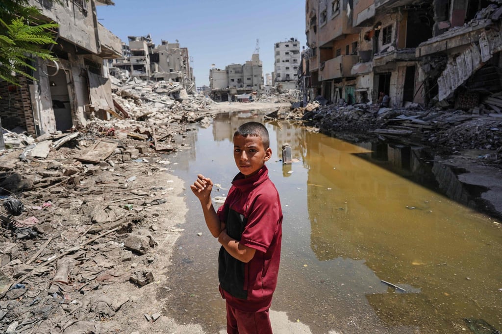 A Palestinian boy, amid the rubble of destroyed buildings in Khan Yunis in the southern Gaza Strip. Photo: AFP