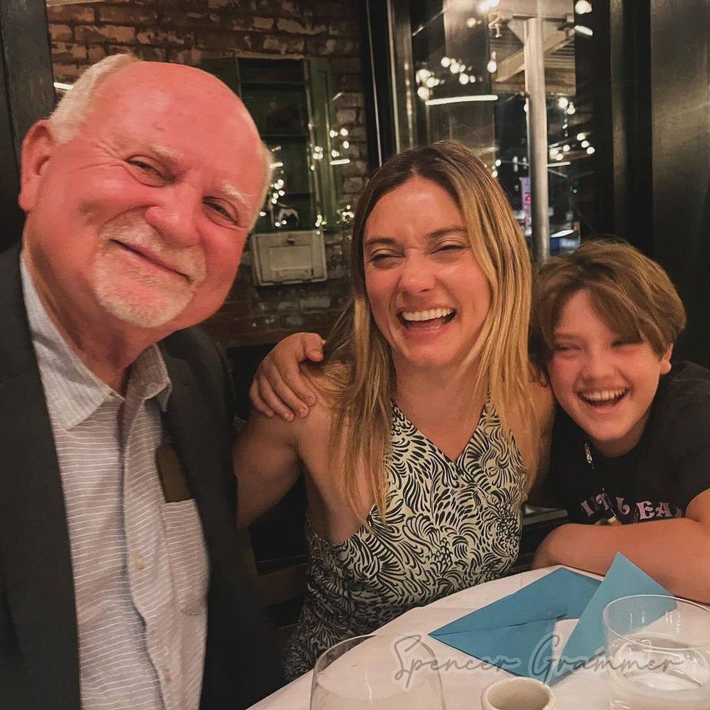 Spencer Grammer with her late stepfather Dr Bill Skinner and son Emmett. Photo: @spencergrammer/Instagram
