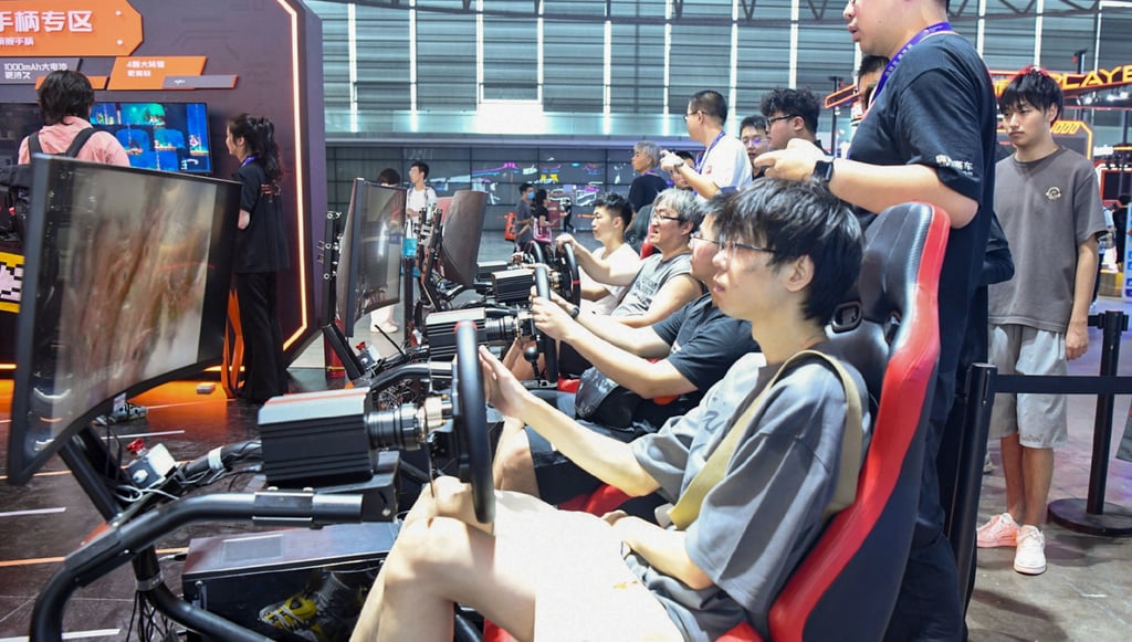 Video gamers try out new products at the opening of the three-day ChinaJoy digital entertainment expo in Shanghai on Friday. Photo: Weibo