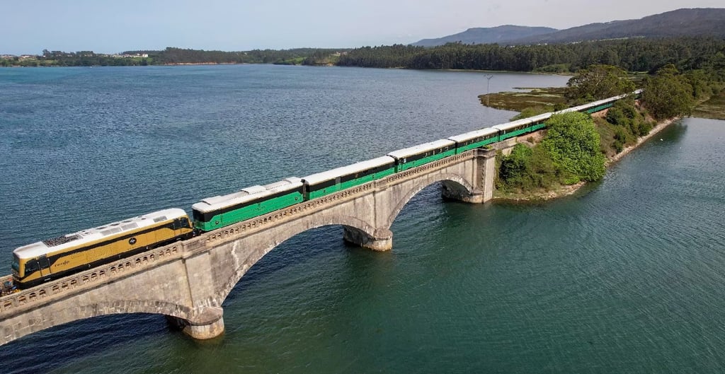 The Costa Verde Express crosses a river estuary on its journey between Bilbao and Santiago de Compostela. Photo: Entire Travel The Costa Verde Express crosses a river estuary on its journey between Bilbao and Santiago de Compostela. Photo: Entire Travel