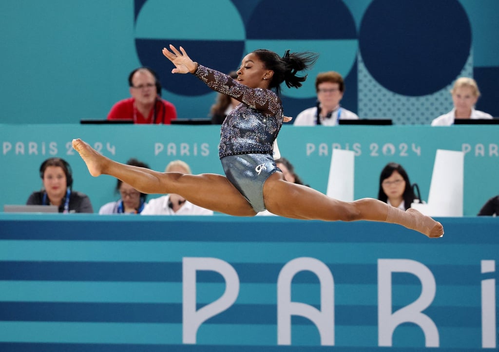 Simone Biles on the floor exercise, where she exited the floor with the US team’s doctor. Photo: Reuters