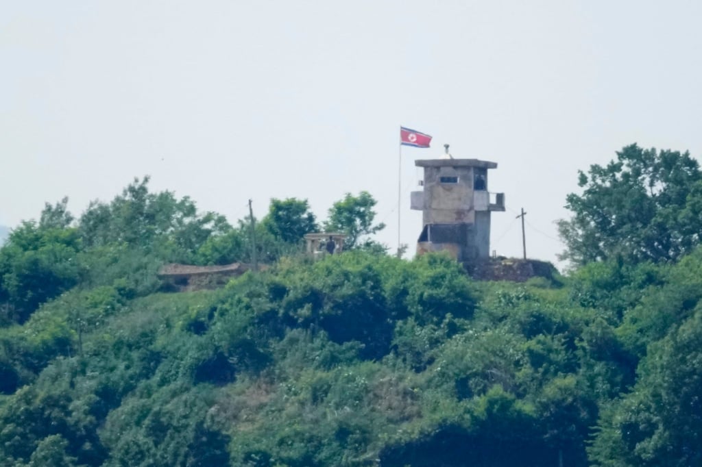 North Korean soldiers stand near their military guard post, seen from Paju, South Korea. Photo: AP
