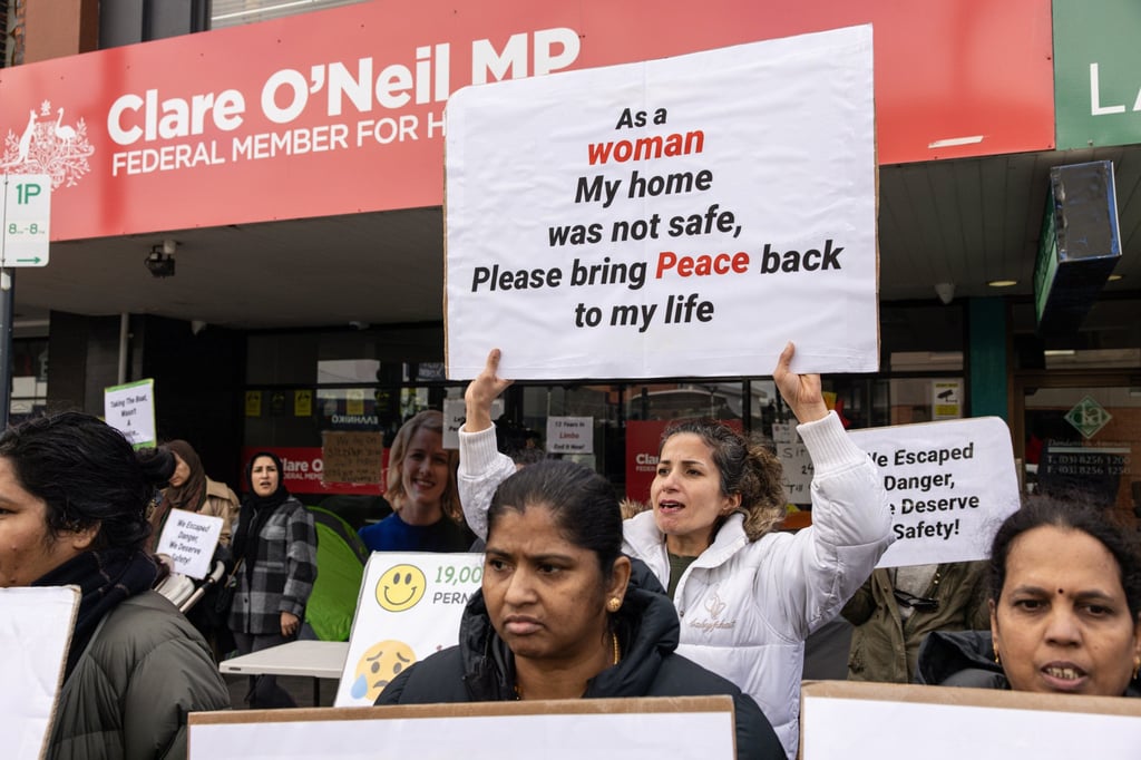 People seeking permanent visas demonstrate outside Australia’s Home Affairs Minister Clare O’Neil’s electoral office in Oakleigh on July 22. Photo: Diego Fedele/AAP/dpa People seeking permanent visas demonstrate outside Australia’s Home Affairs Minister Clare O’Neil’s electoral office in Oakleigh on July 22. Photo: Diego Fedele/AAP/dpa