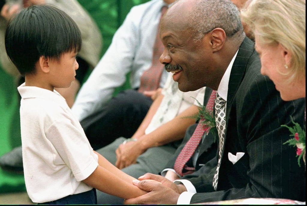Then San Francisco mayor Willie Brown is greeted by a boy at an junior school in Ho Chi Minh City, in 1998. Photo: AP Then San Francisco mayor Willie Brown is greeted by a boy at an junior school in Ho Chi Minh City, in 1998. Photo: AP