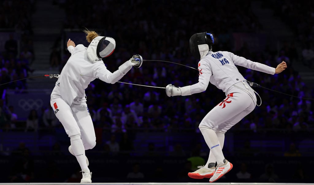 Hong Kong’s Vivian Kong (right) came from 1-7 down to beat France’s Auriane Mallo-Breton for the gold. Photo: Reuters Hong Kong’s Vivian Kong (right) came from 1-7 down to beat France’s Auriane Mallo-Breton for the gold. Photo: Reuters