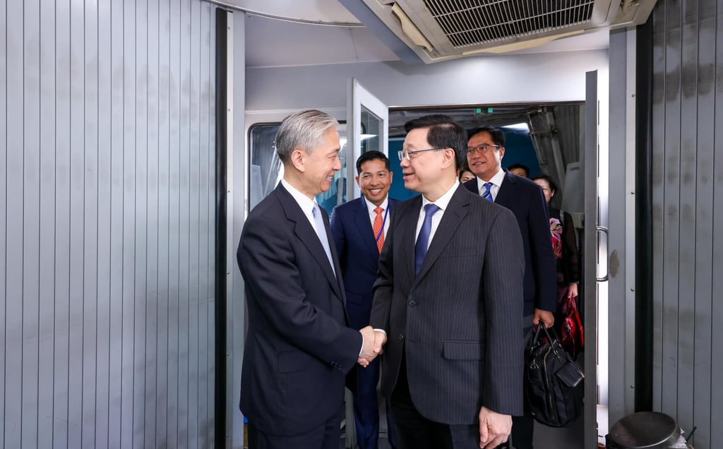 John Lee shakes hands with Chinese ambassador Wang Wenbin, who was previously a spokesman for the foreign ministry in Beijing. Photo: Handout