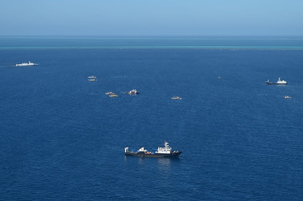 Maritime militia boats sail with a Chinese coastguard ship (upper left) at Scarborough Shoal on February 16. Photo: AFP