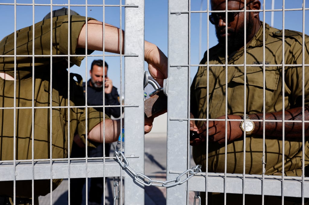 Soldiers lock a gate from the inside at Sde Teiman detention facility. Photo: Reuters Soldiers lock a gate from the inside at Sde Teiman detention facility. Photo: Reuters