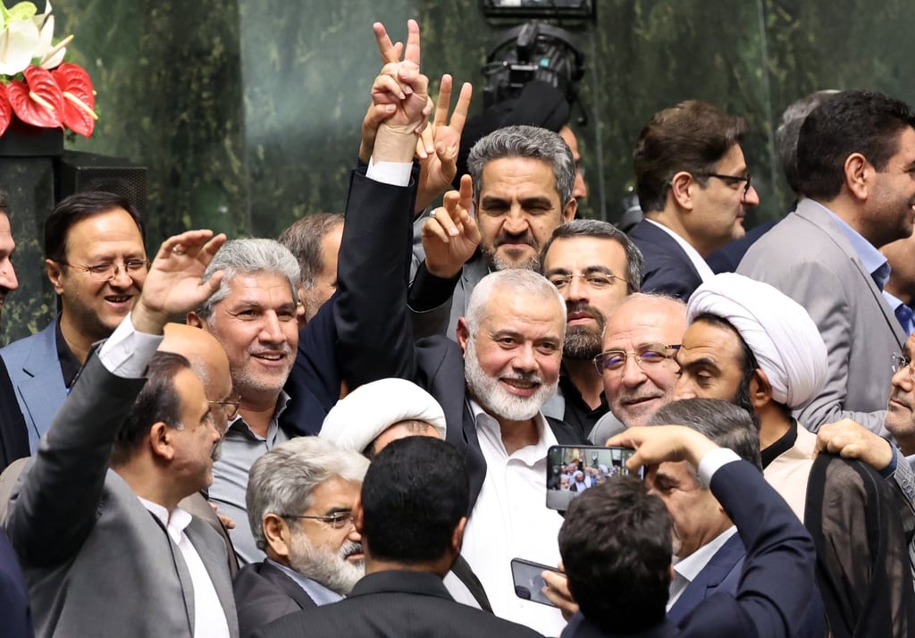Hamas political leader Ismail Haniyeh flashes a victory sign in Tehran earlier Tuesday. Photo: EPA-EFE