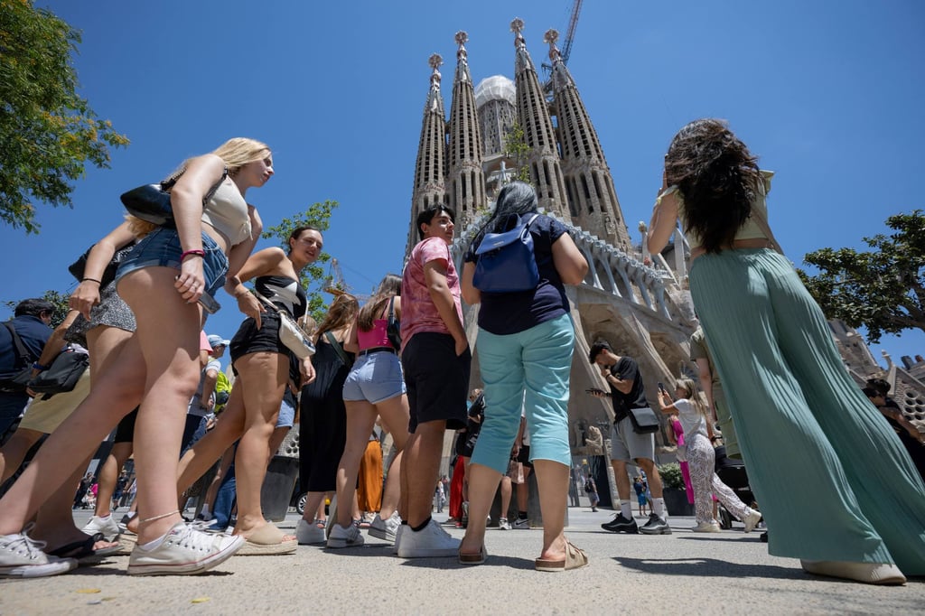 Tourists at Sagrada Familia, Barcelona’s most famous sightseeing spot. Many visitors to the city stay in short-term rental properties, but this is set to change. Photo: AFP