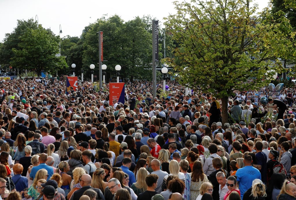 People attend a vigil for the victims of the knife attack in Southport. Photo: Reuters People attend a vigil for the victims of the knife attack in Southport. Photo: Reuters