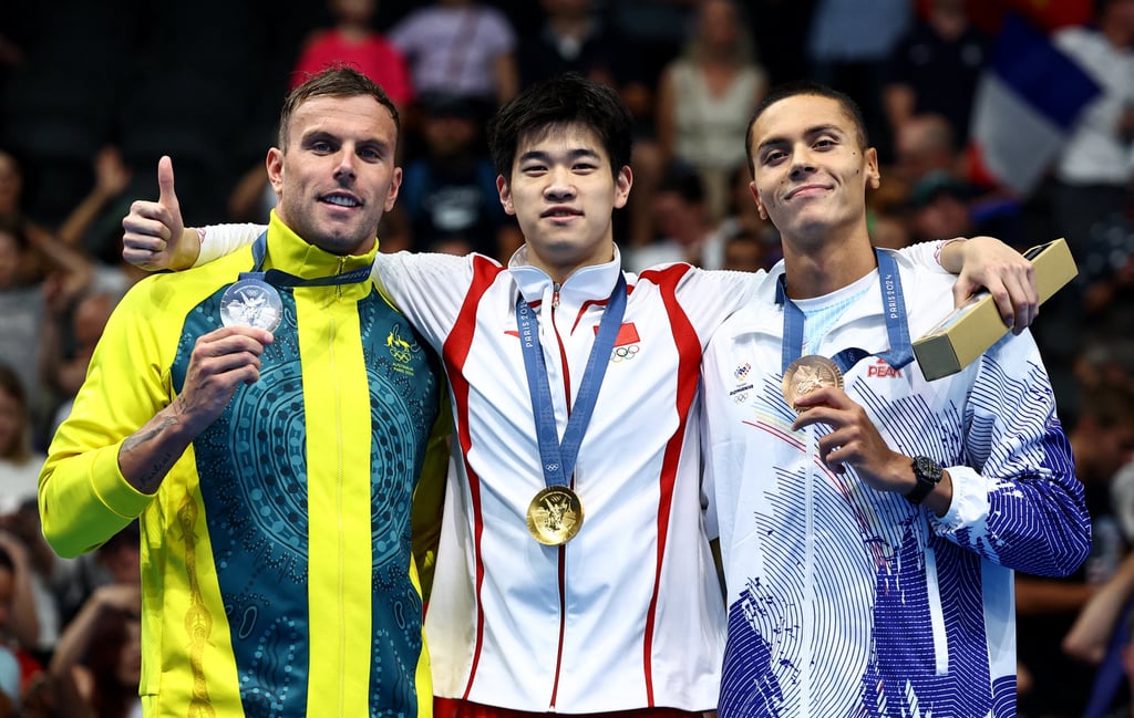Gold medallist Pan Zhanle (centre) on the podium with Australia’s Kyle Chalmers (left), who won silver, and Romania’s David Popovici. Photo: Reuters
