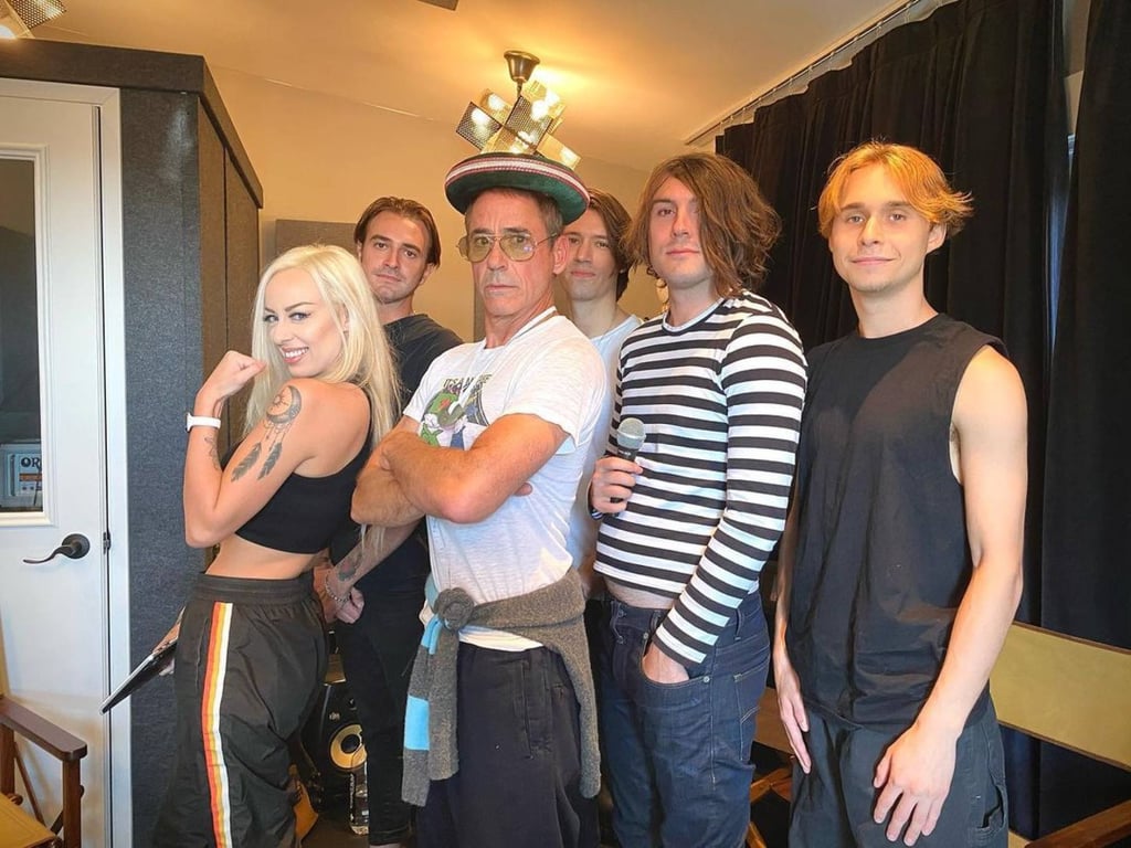 Robert Downey Jr posing with son Indio Downey and his band, Indio Ink. Photo: @robertdowneyjr/Instagram