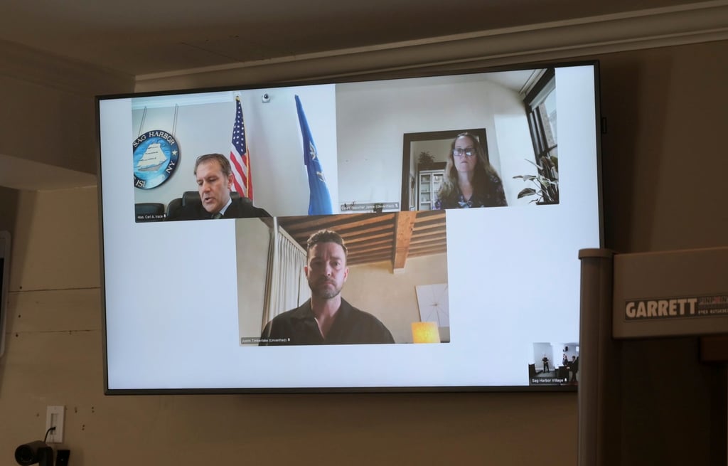 Justin Timberlake (centre) appears by video link during his arraignment in Sag Harbour Justice Carl Irace’s courtroom on Friday. Photo: Newsday via AP