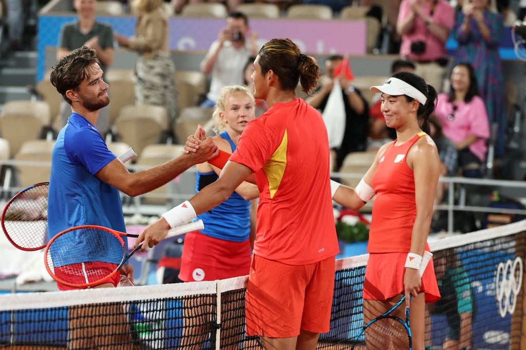 Wang and Zhang after their mixed doubles final defeat to Tomas Machac (left) and Katerina Siniakova of the Czech Republic. Photo: Reuters Wang and Zhang after their mixed doubles final defeat to Tomas Machac (left) and Katerina Siniakova of the Czech Republic. Photo: Reuters