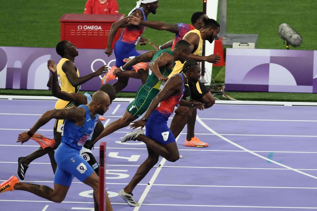 Noah Lyles (near side) does just enough to dip ahead of Kishane Thompson (in yellow). Photo: AFP