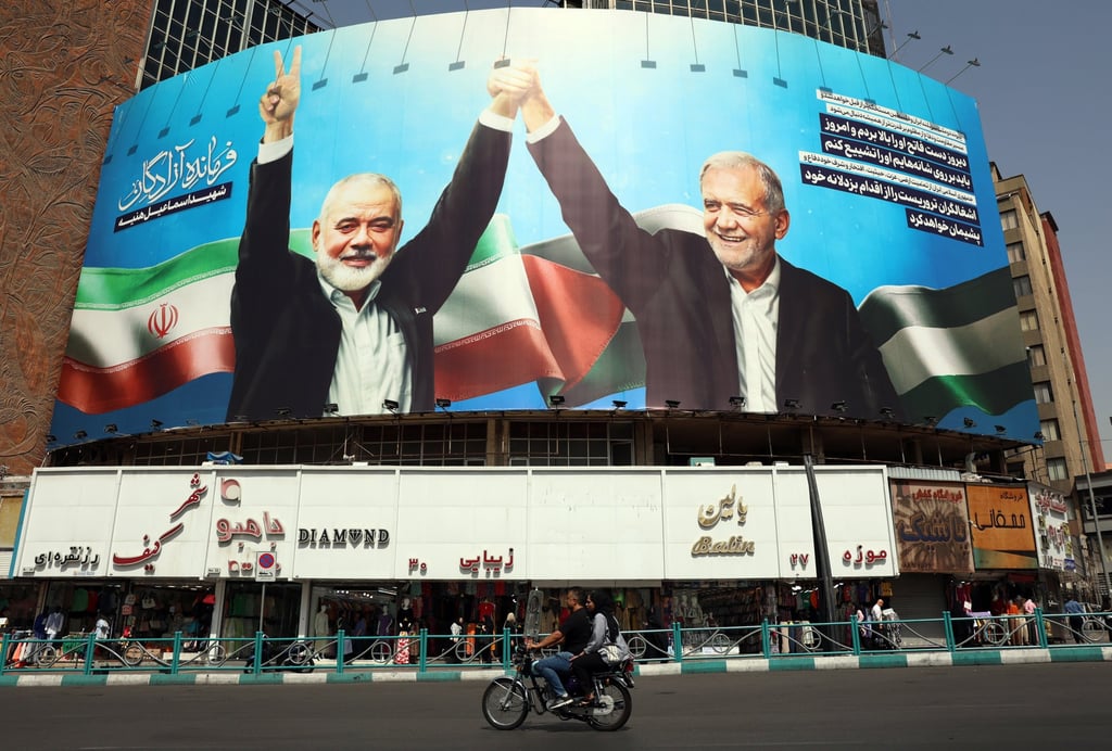 A billboard in Tehran, Iran, depicting late Hamas leader Ismail Haniyeh and Iranian President Masoud Pezeshkian. Photo: EPA-EFE