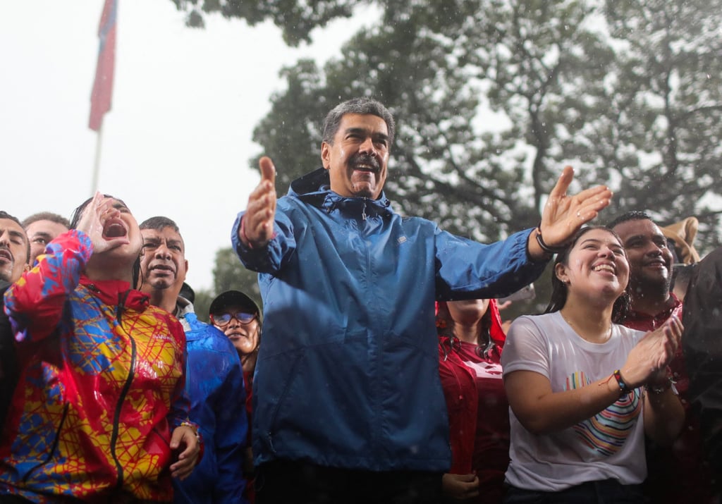 Venezuelan President Nicolas Maduro greeting supporters during a rally in Caracas. Photo: Miraflores press office via AFP