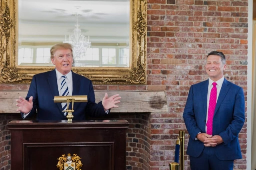 Ronny Jackson (right) smiles as Donald Trump, then US president, makes a speech. Photo: @RonnyJacksonTX/X