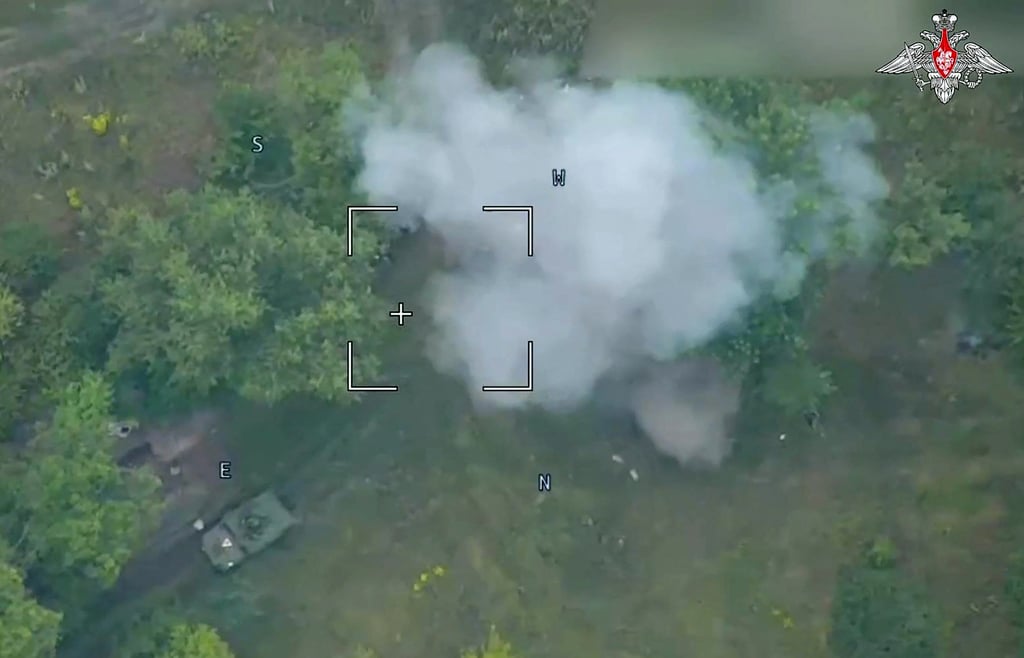 Russian defence ministry footage released on Thursday shows a drone attack on Ukrainian armoured vehicles outside the town of Sudzha, Kursk region. Photo: Russian Defence Ministry via AFP