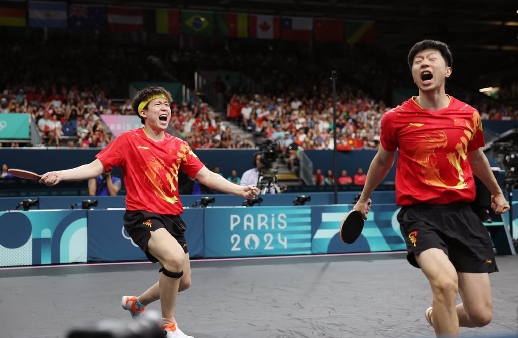 Ma Long (right) and Wang Chuqin celebrate after beating Sweden’s Anton Kallberg and Kristian Karlsson in their opening doubles match. Photo: Xinhua