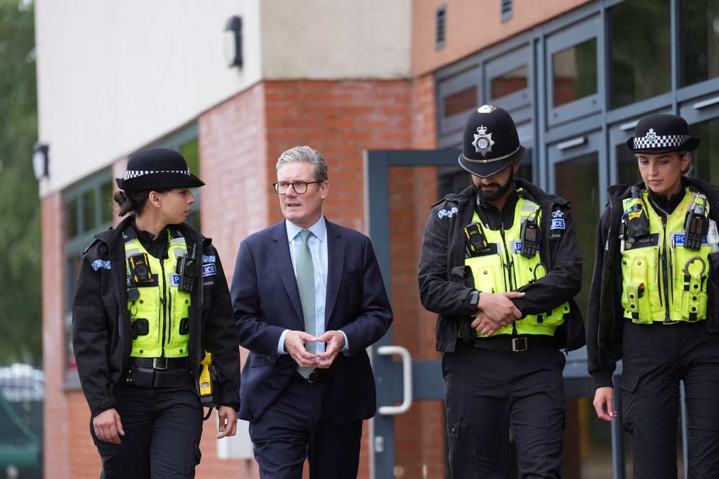 Britain’s Prime Minister Keir Starmer with members of the West Midlands Police Force. Photo: AFP Britain’s Prime Minister Keir Starmer with members of the West Midlands Police Force. Photo: AFP