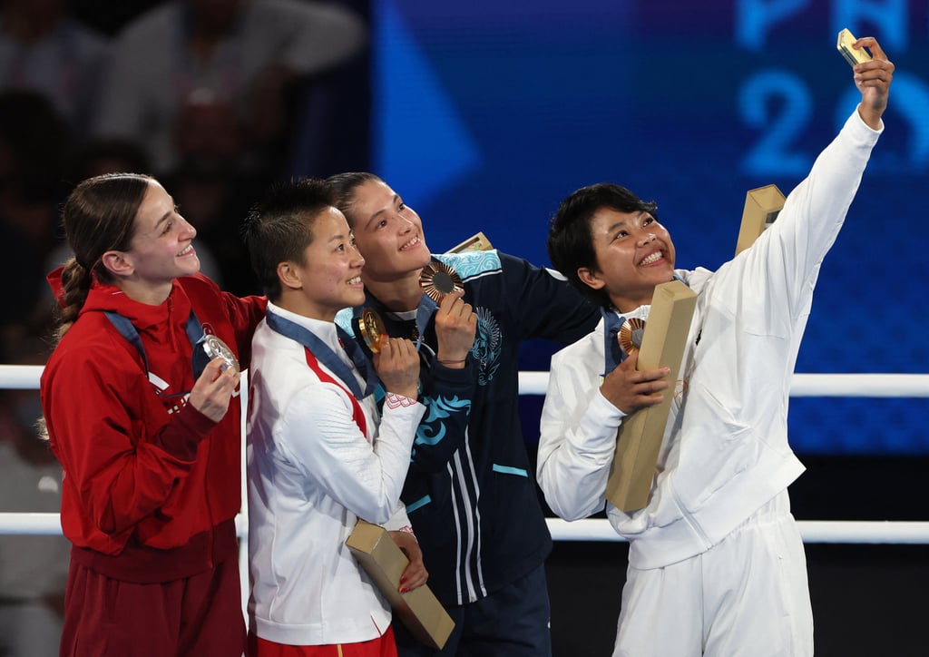 Gold medallist Yu Wu, silver medallist Buse Naz Cakiroglu, bronze medallist Aira Villegas, and bronze medallist Nazym Kyzaibay take a selfie photograph with their medals. Photo: Reuters Gold medallist Yu Wu, silver medallist Buse Naz Cakiroglu, bronze medallist Aira Villegas, and bronze medallist Nazym Kyzaibay take a selfie photograph with their medals. Photo: Reuters