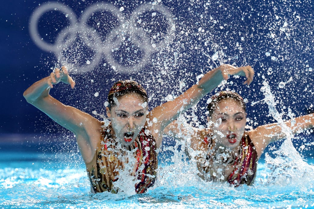 Wang Qianyi (right, with sister Liuyi) says being twins helps with the execution and artistic elements of their performance. Photo: Reuters