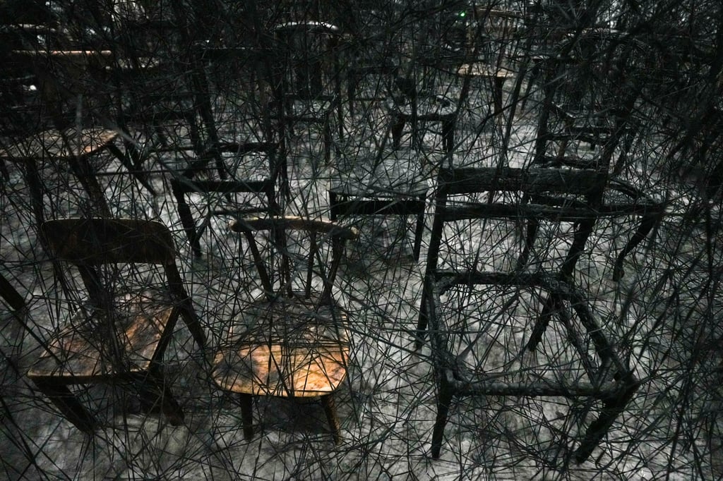 A close-up of the art installation, In Silence, at “Shiota Chiharu: The Soul Trembles”. The exhibition is showcased at the newly opened Shenzhen Art Museum. Berlin-based artist Shiota Chiharu is famous for using and large-scale installations of red and black threads to express memories, anxiety, dreams, silence and more. Photo: Eugene Lee