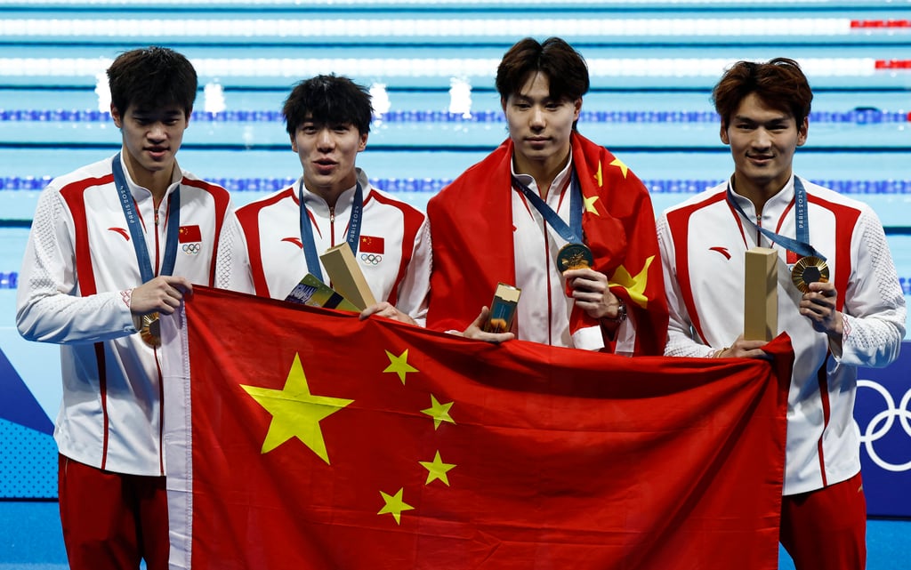 Pan Zhanle (left) inspired China to gold in swimming’s men’s 4x100m medley relay. Photo: Reuters