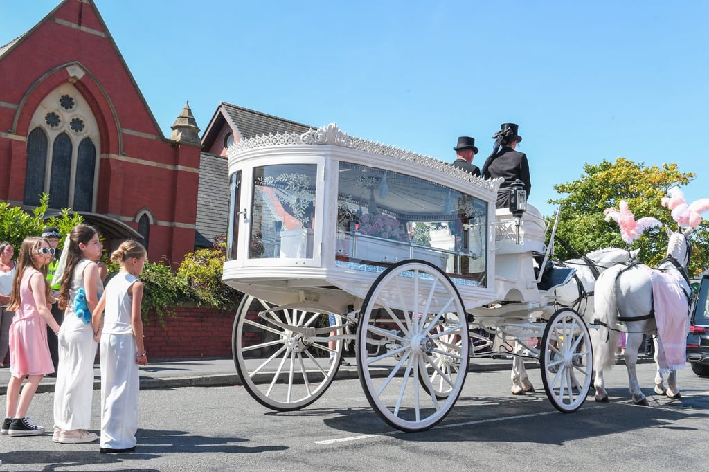 The coffin of Alice da Silva Aguiar on a horse-drawn carriage near St Patrick’s Catholic Church in Southport, UK on Sunday. Photo: EPA-EFE The coffin of Alice da Silva Aguiar on a horse-drawn carriage near St Patrick’s Catholic Church in Southport, UK on Sunday. Photo: EPA-EFE