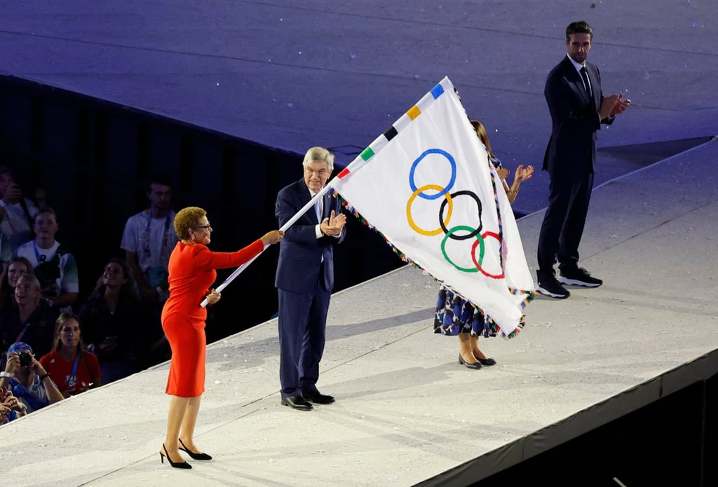 Karen Bass becomes the first black, woman mayor to receive the Olympic flag at a closing ceremony. Photo: Reuters