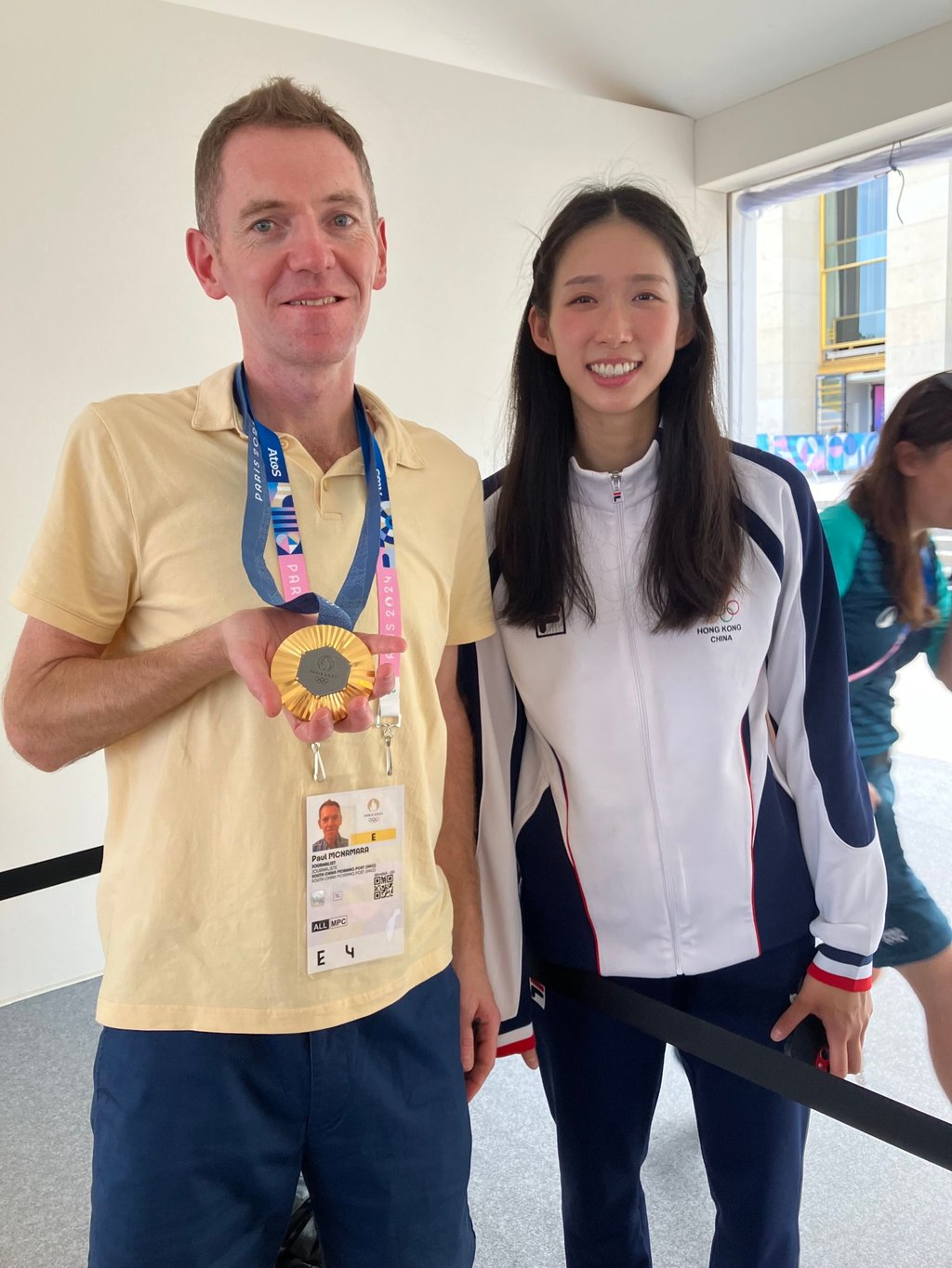 Post reporter Paul McNamara tries on Vivian Kong’s gold medal for size at an interview with the Hong Kong fencer. Photo: Paul McNamara Post reporter Paul McNamara tries on Vivian Kong’s gold medal for size at an interview with the Hong Kong fencer. Photo: Paul McNamara