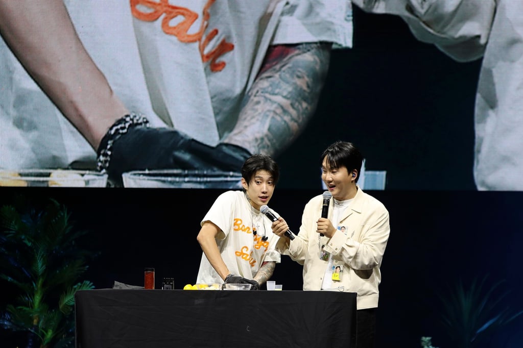 Park (left) makes his viral garlic health drinks on stage during a fan meeting at Myunghwa Live Hall in Seoul, South Korea, on August 11, 2024. Photo: AP