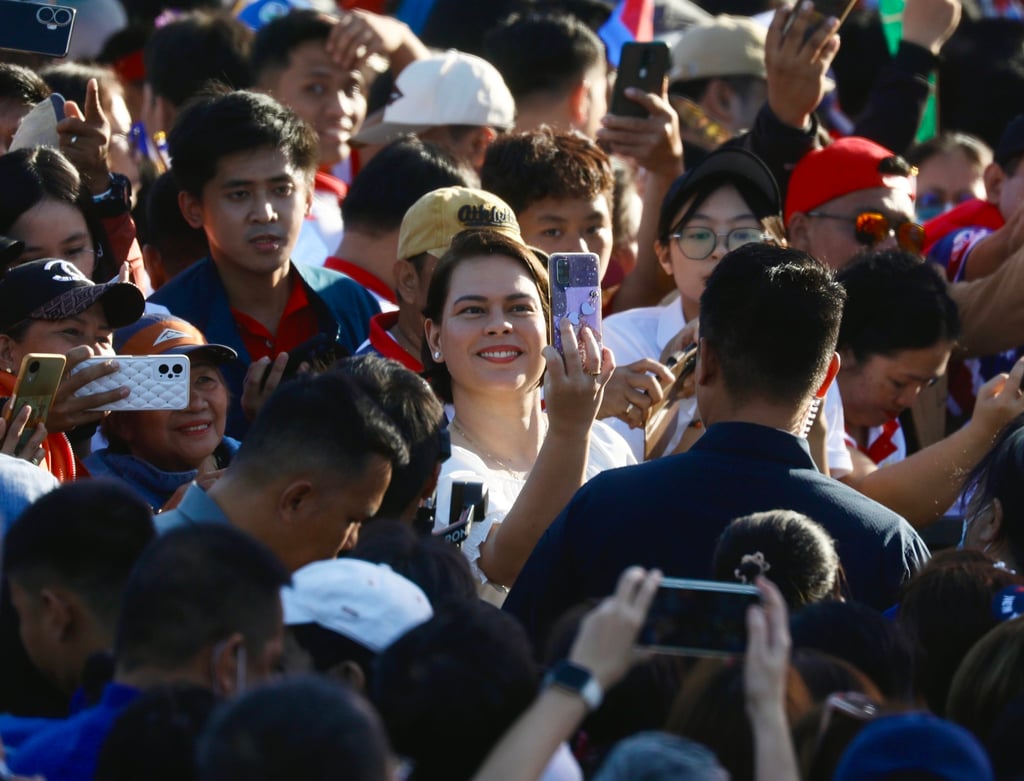 Philippine Vice-President Sara Duterte (centre) takes a selfie with her supporters during a rally in Manila in January. Photo: EPA-EFE