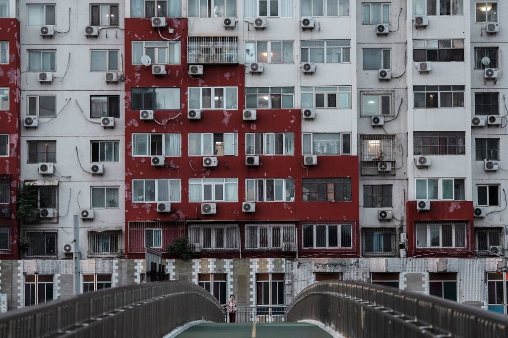 Air conditioning units hanging from a building in Beijing on August 1, 2024. Photo: Bloomberg.