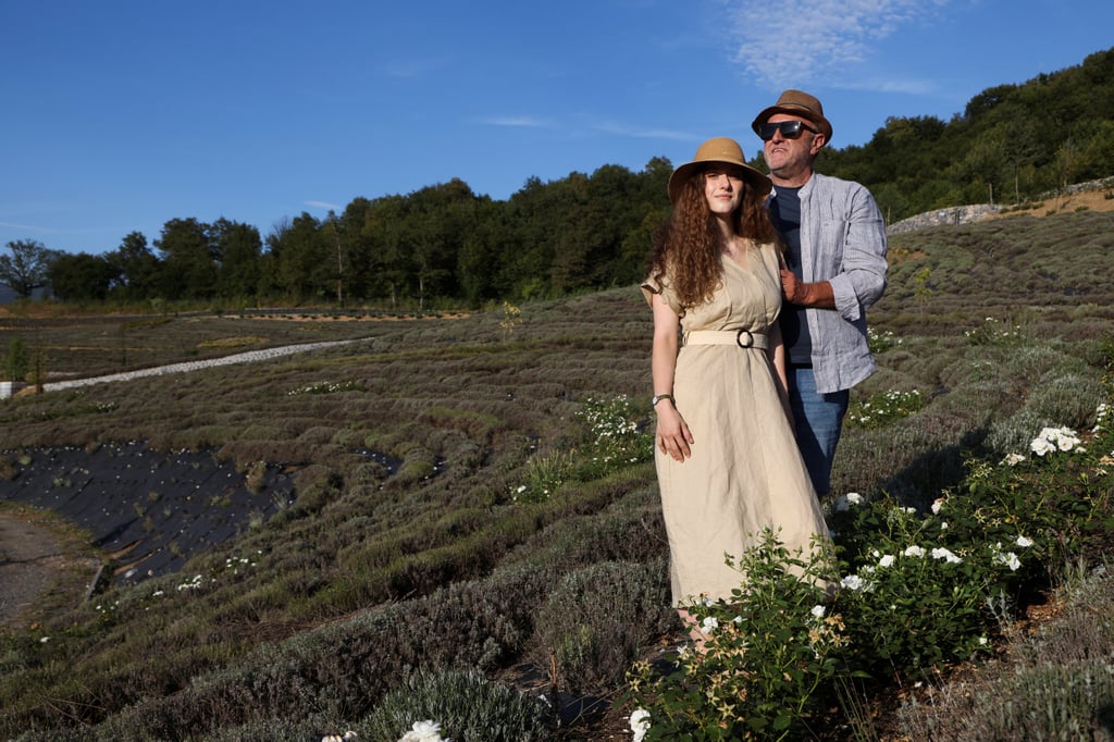 Halim Zukic and his daughter Emina stand amid lavender bushes and shrubs at the Starry Night park in Visoko. Photo: Reuters