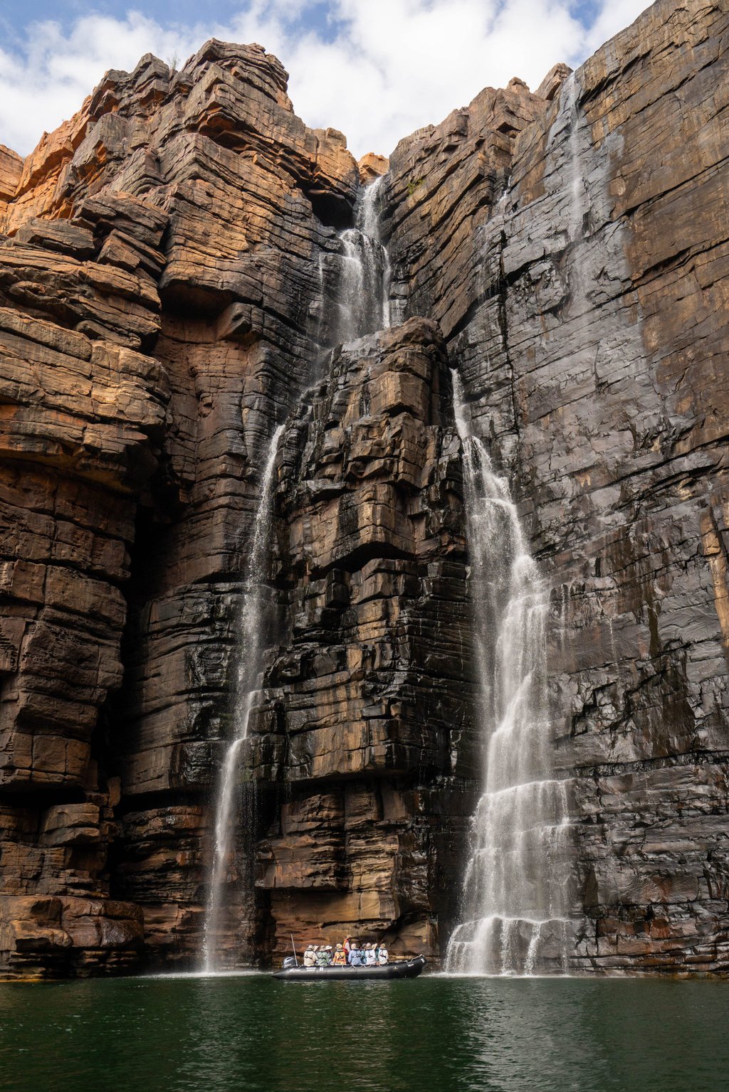 Beneath one of the stunning waterfalls at King George River. Photo: Seabourn