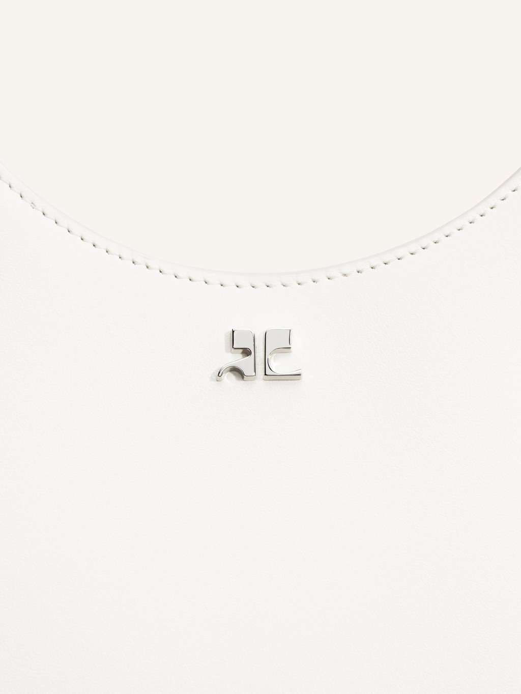 The Holy Bag is the epitome of quiet luxury thanks to its discreet metallic logo. Photo: Courrèges