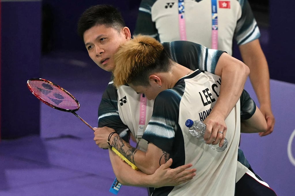 Hong Kong’s Lee Cheuk-yiu celebrates with his coach after his win against Mexico’s Luis Ramon Garrido in their men’s singles badminton group stage match at the Paris 2024 Olympic Games. Photo: AFP Hong Kong’s Lee Cheuk-yiu celebrates with his coach after his win against Mexico’s Luis Ramon Garrido in their men’s singles badminton group stage match at the Paris 2024 Olympic Games. Photo: AFP