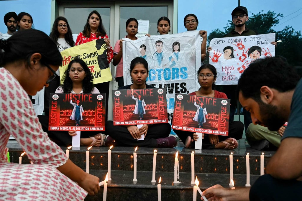 Medical professionals in Amritsar, Punjab state, light candles on Sunday as they pay tribute to the trainee doctor who was killed in Kolkata. Photo: AFP