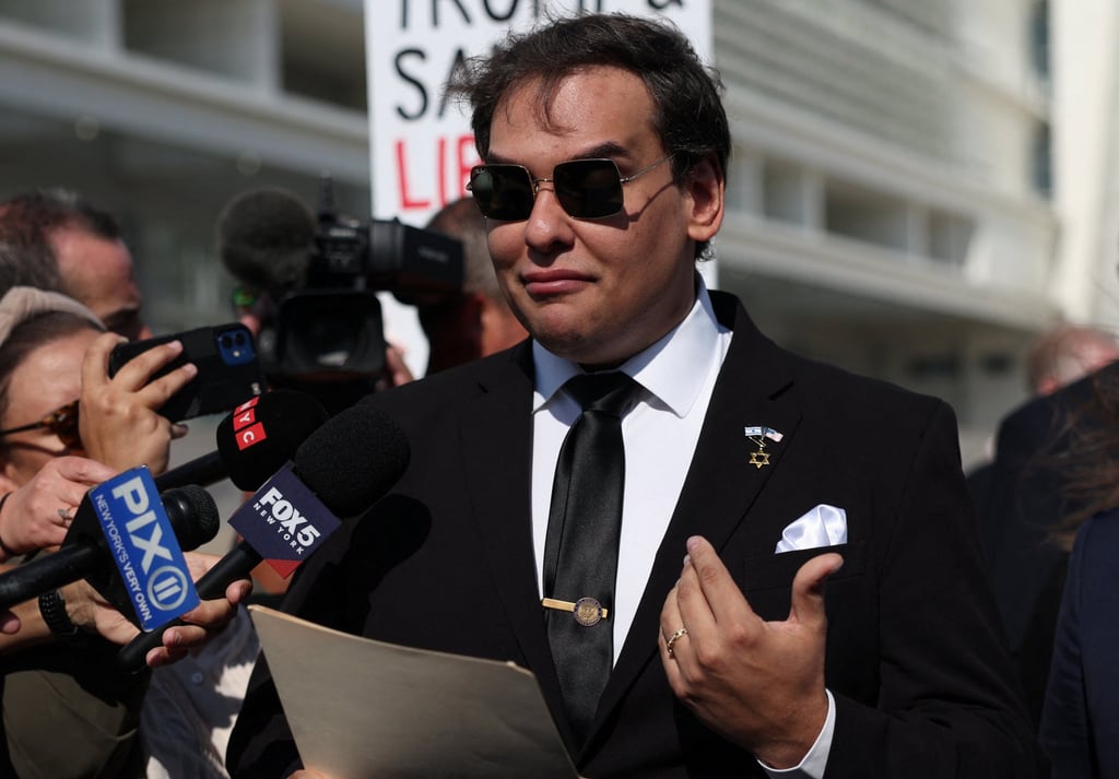 Santos reads a statement after pleading guilty to criminal corruption charges at Central Islip Federal Courthouse in Central Islip, New York on Monday. Photo: Reuters
