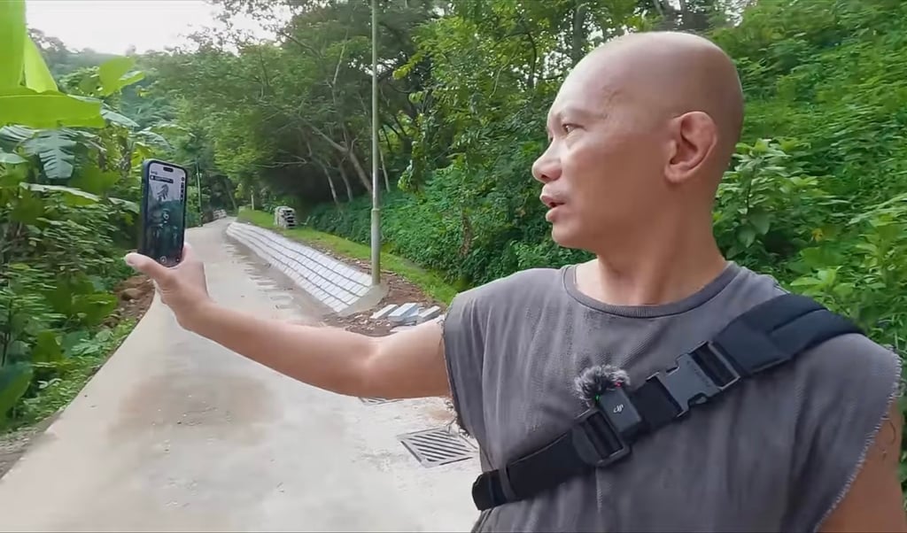 Poon uses a ghost-hunting app while seeking spirits. Photo: Edmond Poon