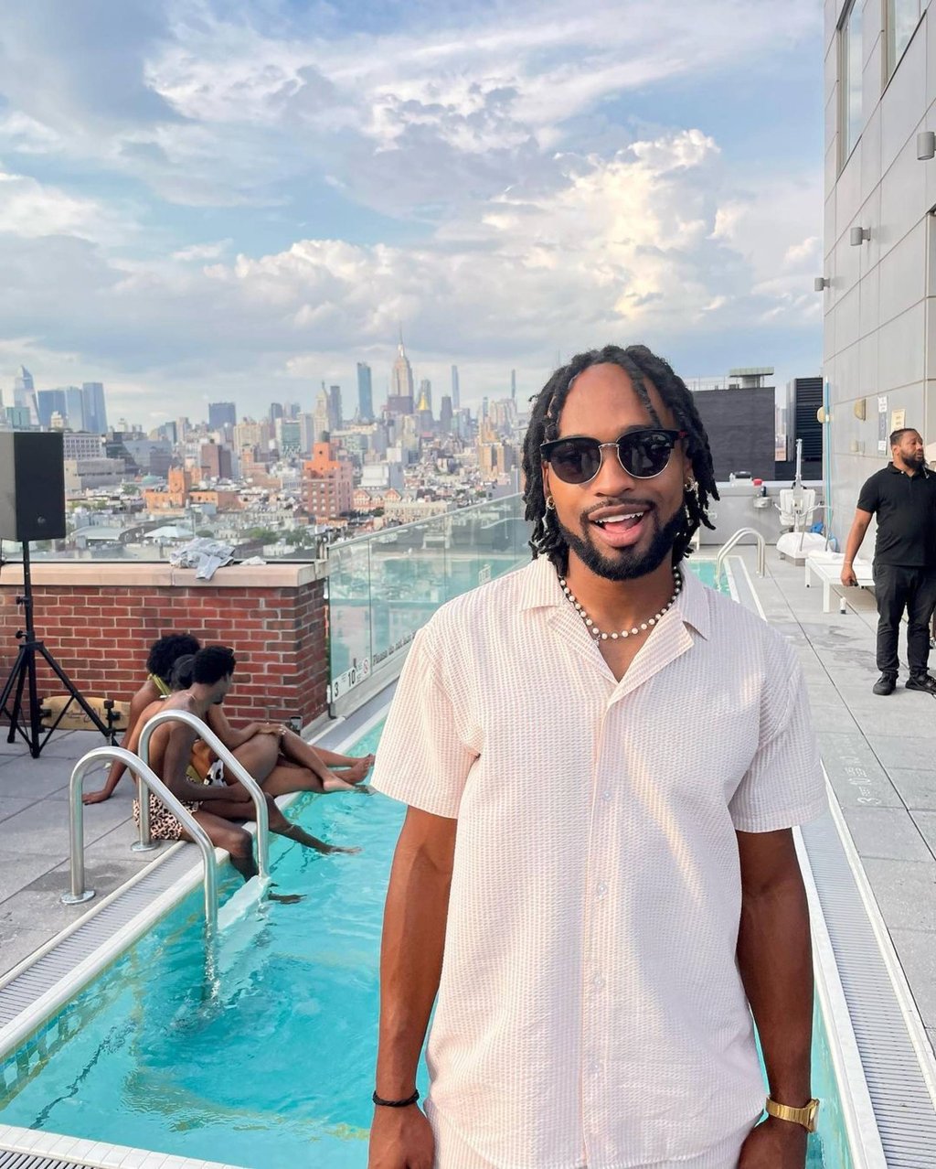 Madonna’s rumoured partner, Akeem Morris, shows off his drip by a rooftop pool in New York. Photo: @akkmorris/Instagram