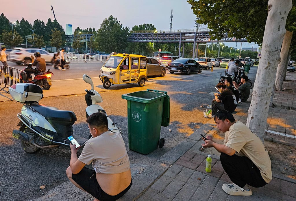 Foxconn workers during an evening break outside the factory in Zhengzhou on August 15, 2024. Photo: Coco Feng